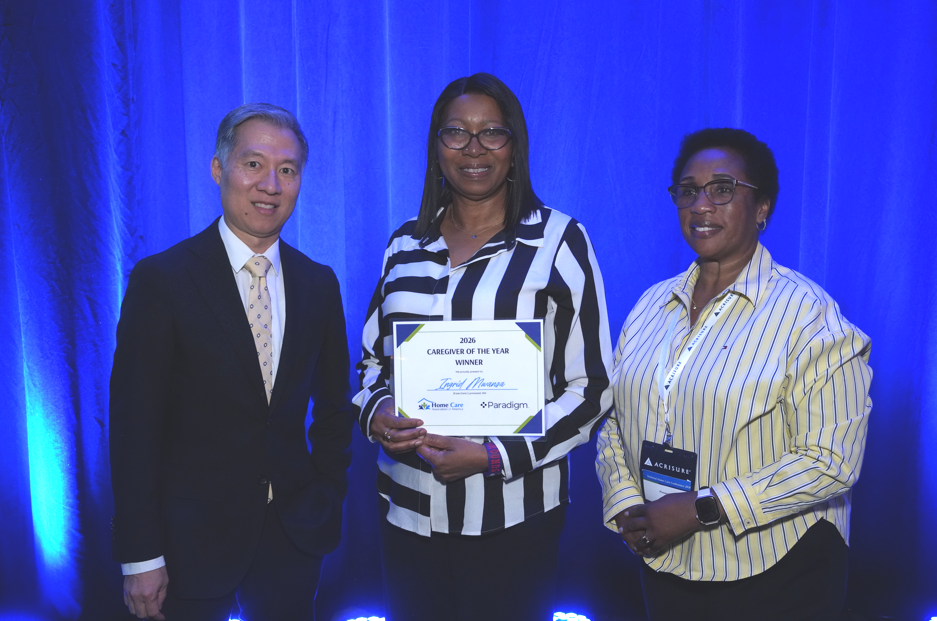 Ingrid Mwansa on stage with the other HCAOA 2026 Caregiver of the Year finalists at the National Home Care Conference in Orlando